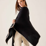 Black and cream whipstitch travel wrap with a pointed edge.
