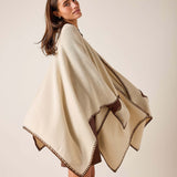 Cream wrap with bronze whipstitch detailing along the hem.