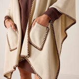 Cream and bronze whipstitch wrap with front pockets.