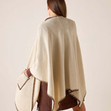 Back view of the cream wrap with bronze whipstitch detailing.