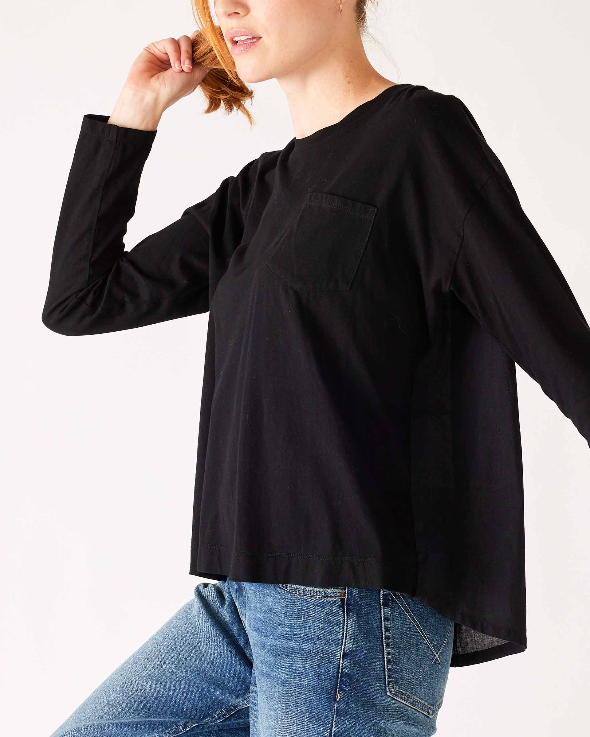Women's Black Front Pocket Pleated Back Crew Neck Long Sleeve Tee Side View Front Pocket Detail