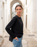 Women's Black Front Pocket Pleated Back Crew Neck Long Sleeve Tee Side View Travel Destination Hand in Pocket