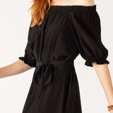 Women's Black Ruffled Shoulder Midi Dress Close-up Side View Walking