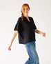 Women's One Size Black Short Sleeve Tee with Two Pockets on Chest Side View Walking
