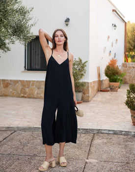 Women's Black V-neck Wide Leg Patio Jumpsuit with Adjustable Strap Front View Travel Destination Look