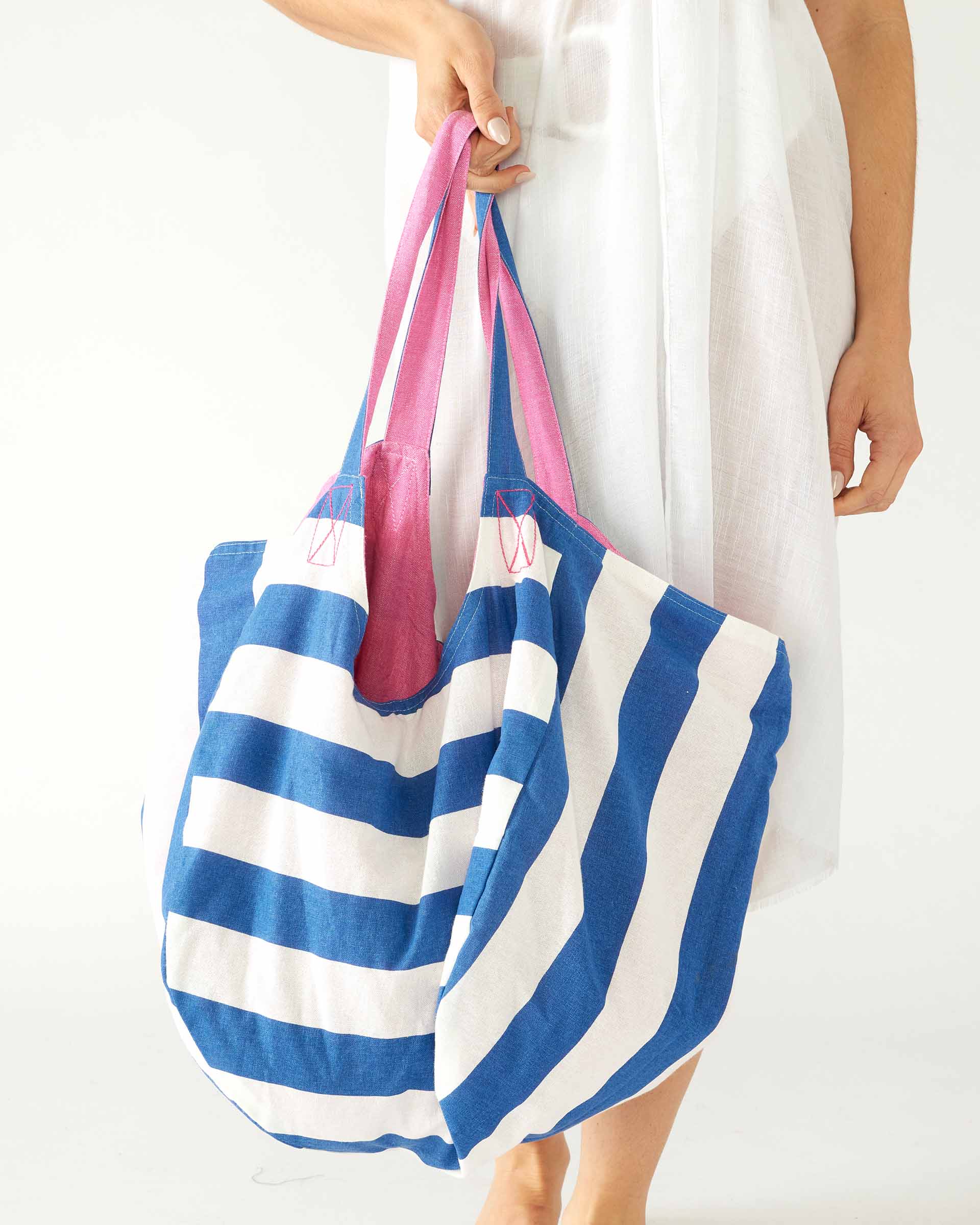 Women's Cotton Blue Striped Solid Pink Reversible Gemini Beach Day Tote with Twill Tie Closure and Interior Slip Pocket Exterior Striped Side