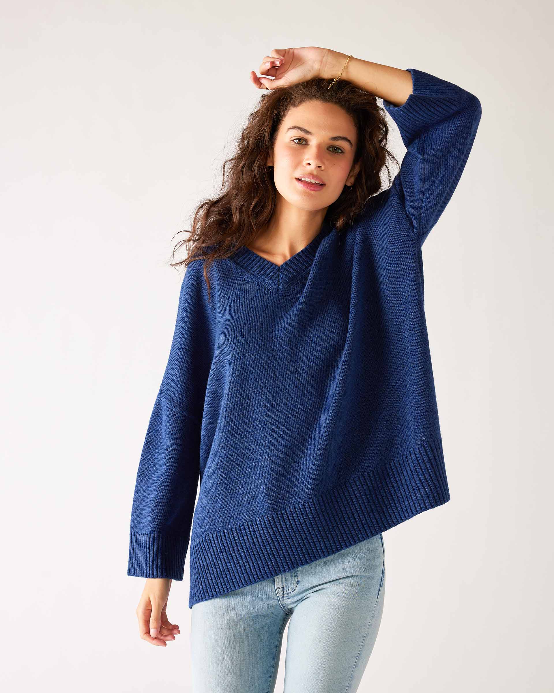Women's Dark Blue Midweight Loose Fitting V-neck Sweater Front View Hand on Head