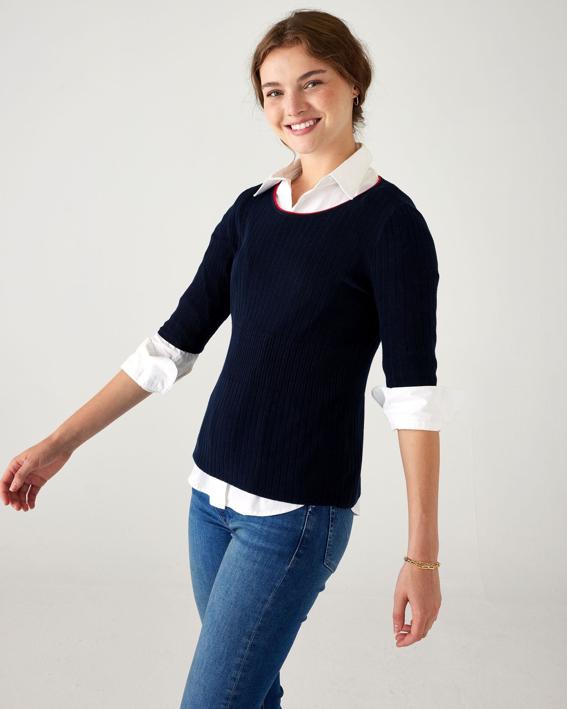 Women's Fall Autumn Navy Short Sleeve Rib Knit Peplum Waistline Sweater With Red Neckline Detail Front View 3