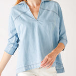 Women's Light Blue Chambray Relaxed Fit Cuffed Sleeves Faux Pearl Snap Detail Popover Top Front View