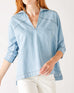 Women's Light Blue Chambray Relaxed Fit Cuffed Sleeves Faux Pearl Snap Detail Popover Top Front View