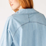 Women's Light Blue Chambray Relaxed Fit Cuffed Sleeves Faux Pearl Snap Detail Popover Top Rear View