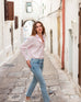 Women's Light Pink Breathable Relaxed Fit Button Up Shirt Side View Travel Destination Look while Walking
