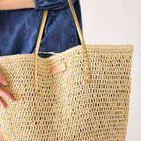 Women's Medium Beach Day Natural Leather Strap Paper Straw Sun Chaser Tote Bag with Chambray Lining and Interior Pockets Closeup