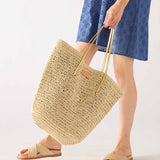 Women's Medium Beach Day Natural Leather Strap Paper Straw Sun Chaser Tote Bag with Chambray Lining and Interior Pockets Front View