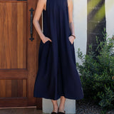 Women wearing Navy Maxi Dress with Pockets by a door