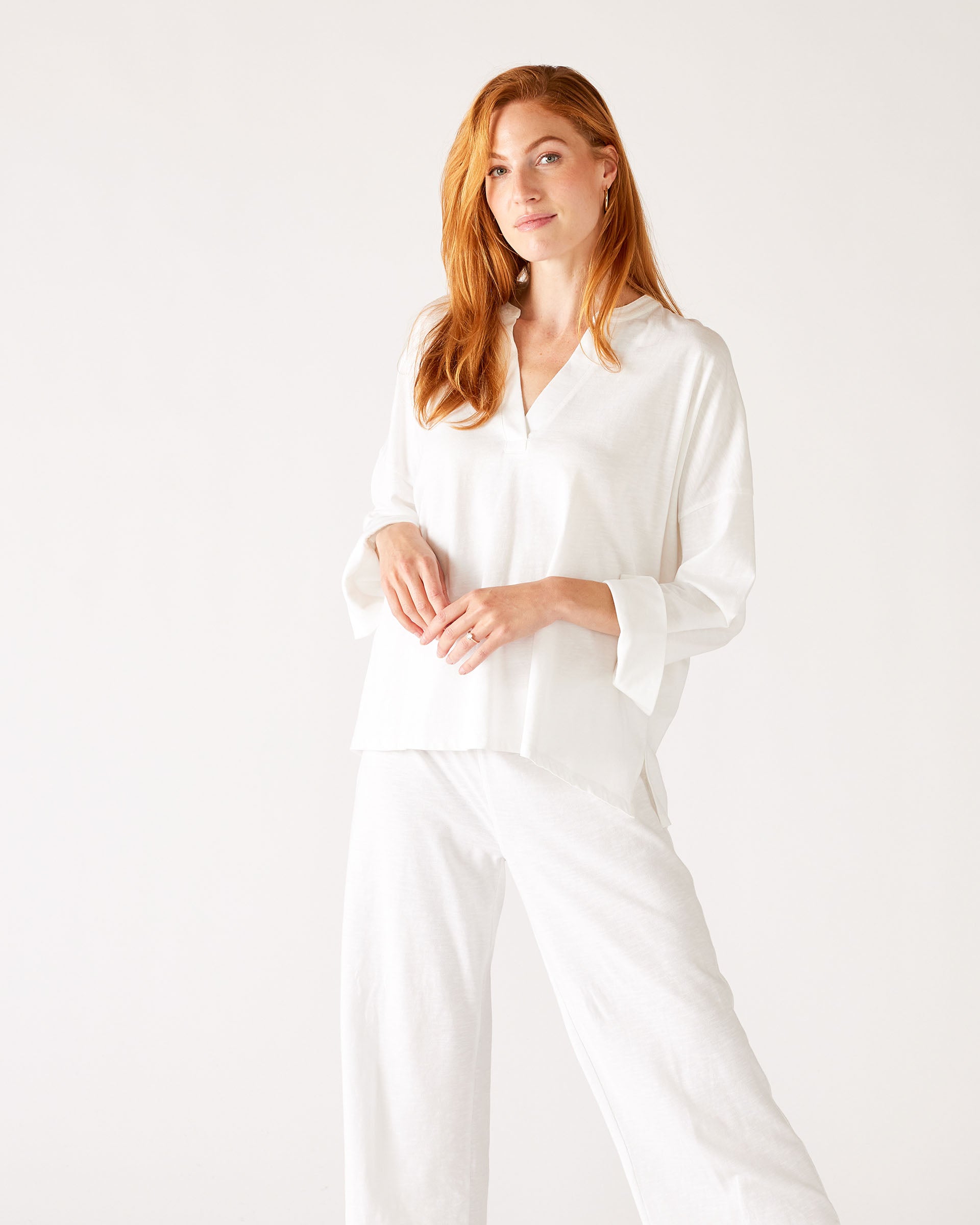 MERSEA women's travel-friendly white cuff tee and wide-leg pants set in a matching two-piece look.
