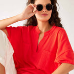 Women's One Size Red Short Sleeve Tee with Two Pockets on Chest Front View Sitting