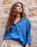 Women's Royal Blue Breathable Relaxed Fit Button Up Shirt Front View Travel Destination Look with Tucked Shirt