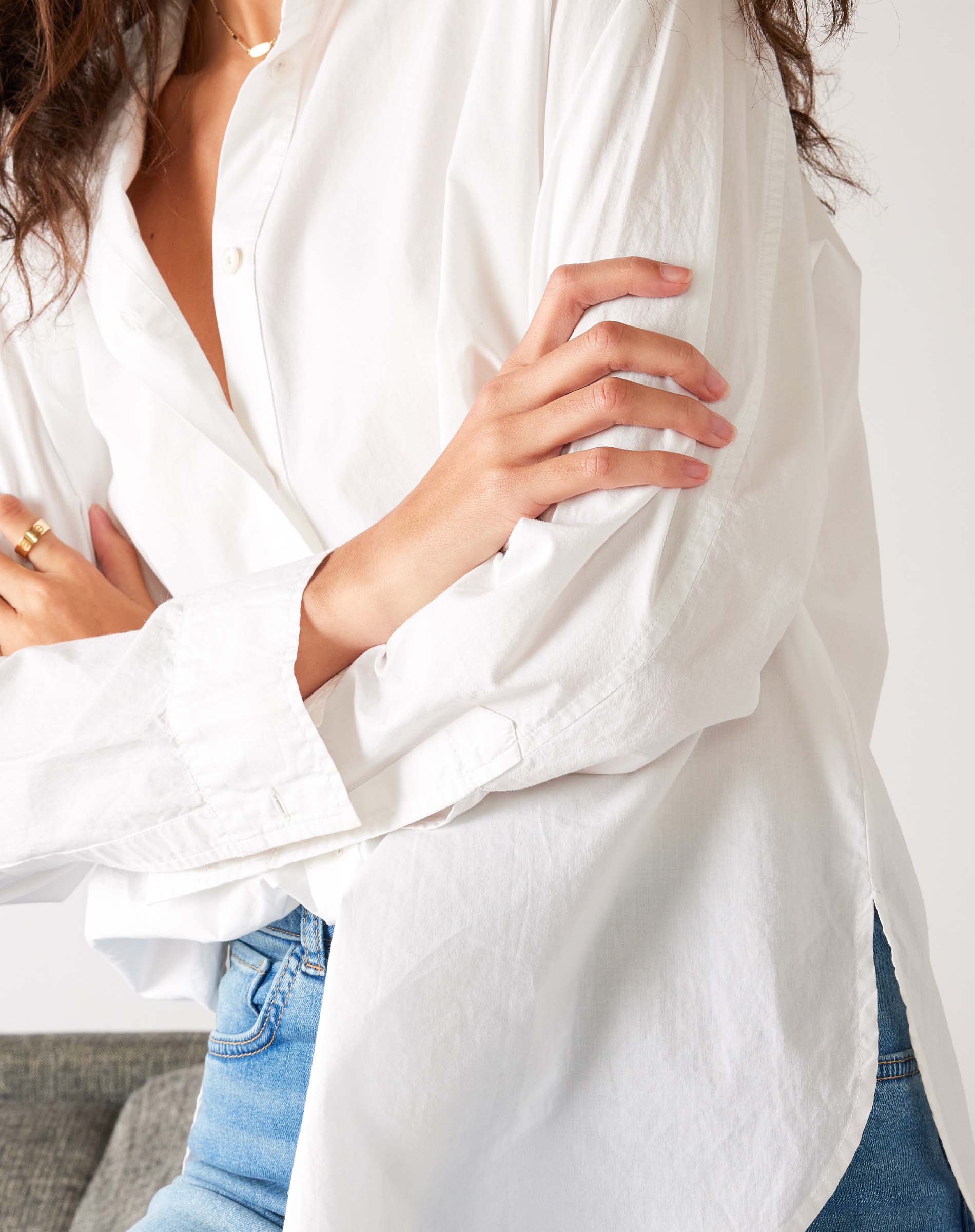 Women's White Breathable Relaxed Fit Button Up Shirt Front View Close Up with Arms Crossed