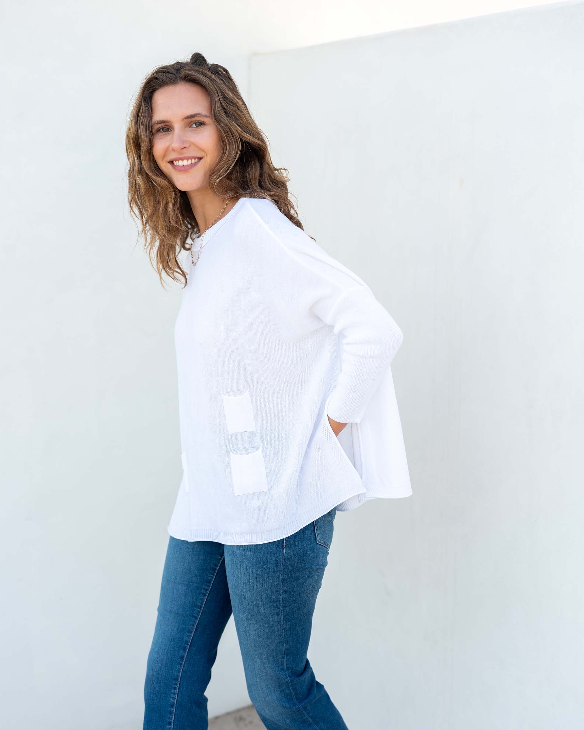 MERSEA women's travel-friendly white oversized crewneck knit sweater with two front patches and three-quarter length sleeves.