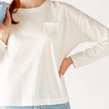 Women's White Front Pocket Pleated Back Crew Neck Long Sleeve Tee Front View Pocket Detail