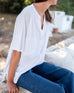 Women's One Size White Short Sleeve Tee with Two Pockets on Chest Front View Sitting