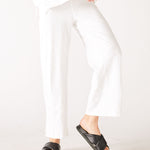 Women's White Wide Leg Ankle side Slit Elastic Waist Pant Front View Knee Bend