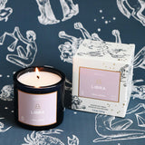 Libra candle and packaging on a zodiac-themed background