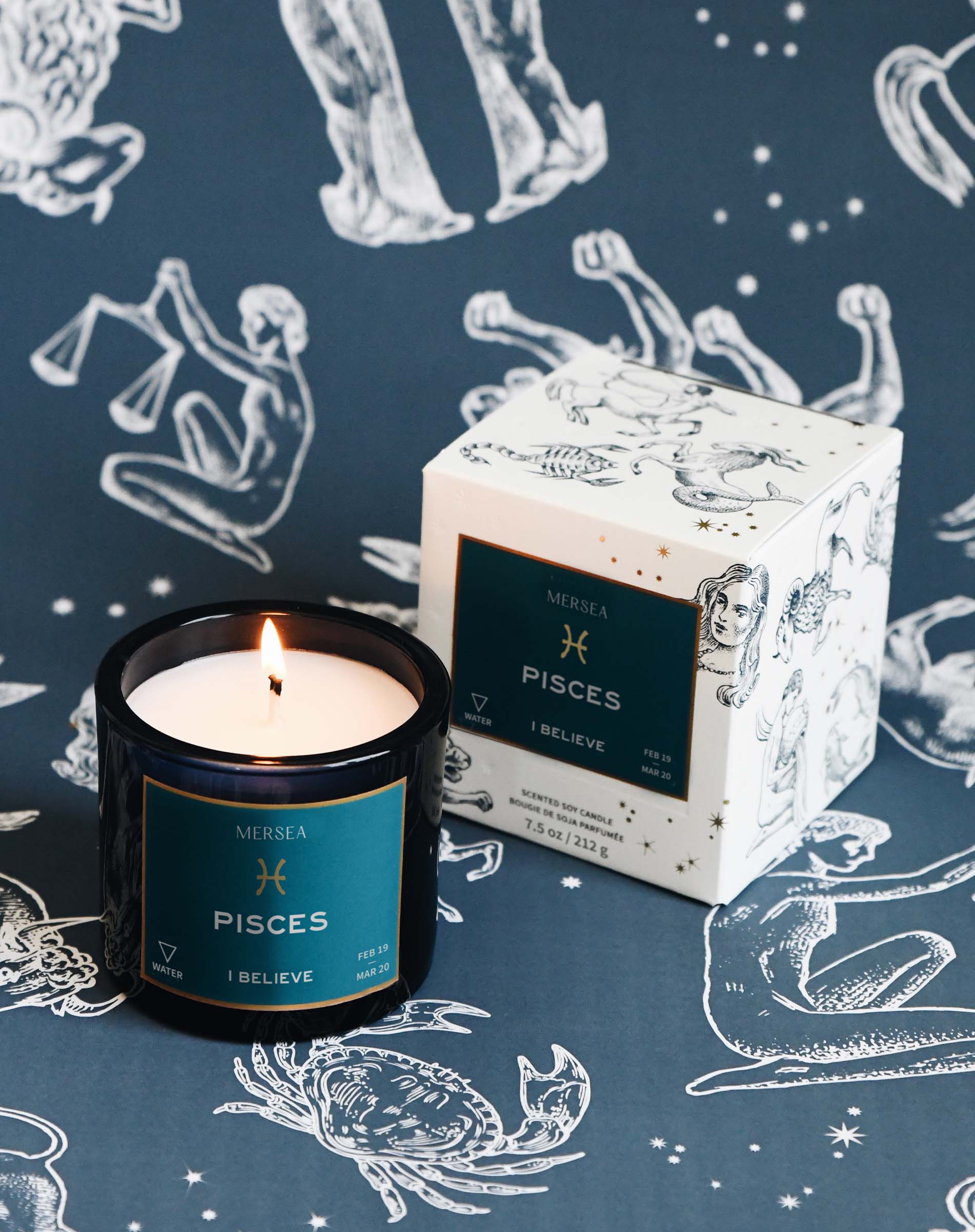 Pisces candle and packaging on a blue background with zodiac illustrations