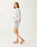 female wearing navy striped white linen blazer and matching shorts sideways on a white background