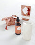 Dune scented oil burner, soap, bath salt, and ceramic candle holder on white background