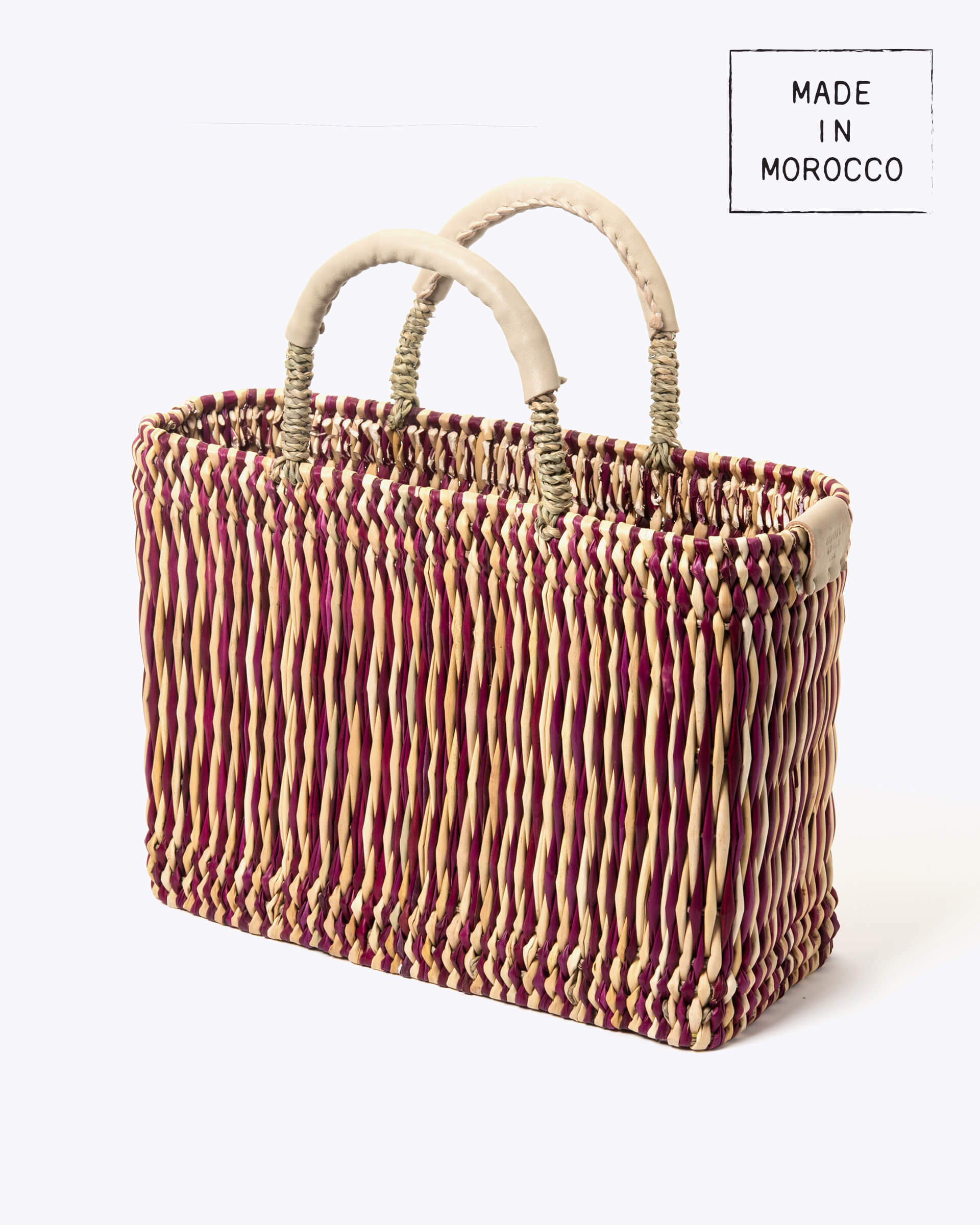 medium straw red stripe basket wrapped with neutral leather handle on a white background at an angle