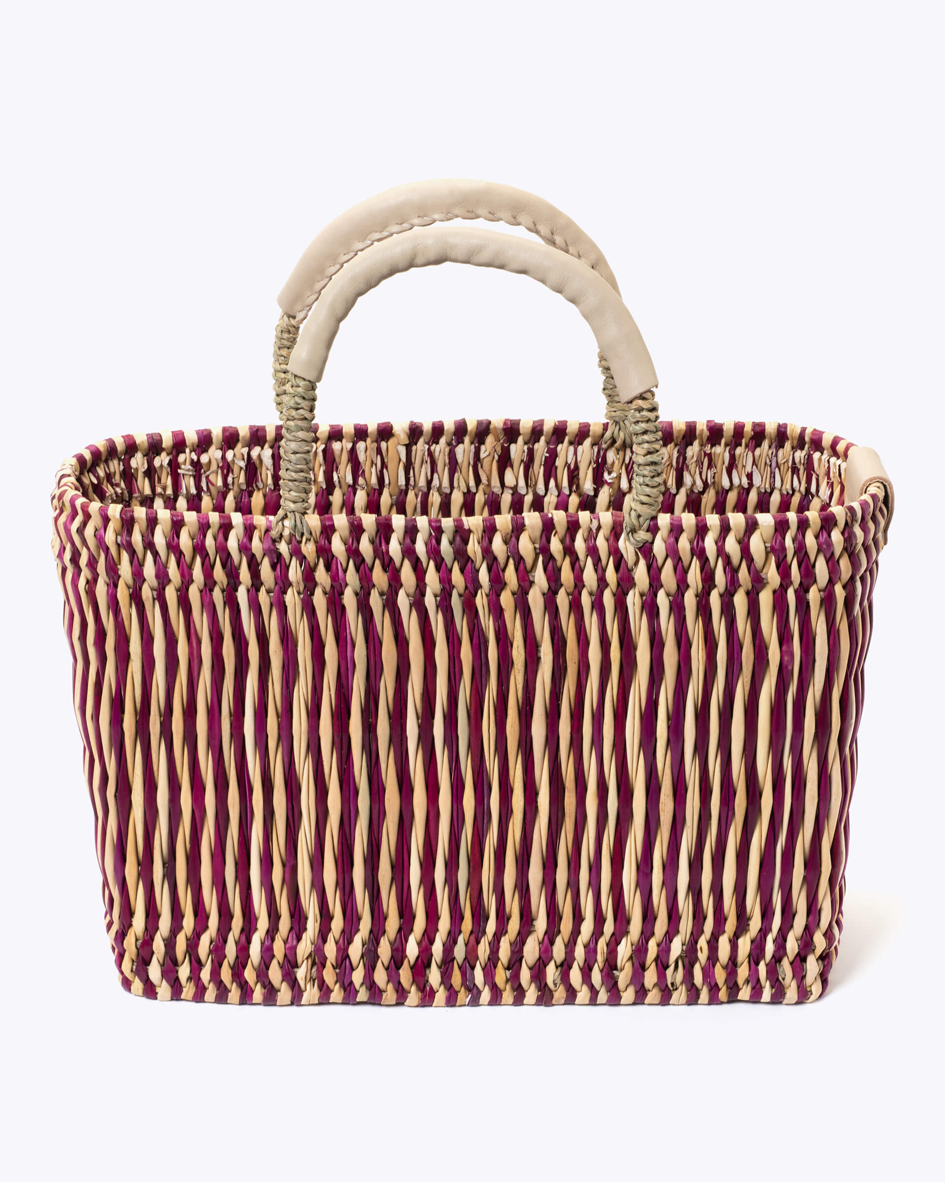 medium straw red stripe basket wrapped with neutral leather handle on a white background 
