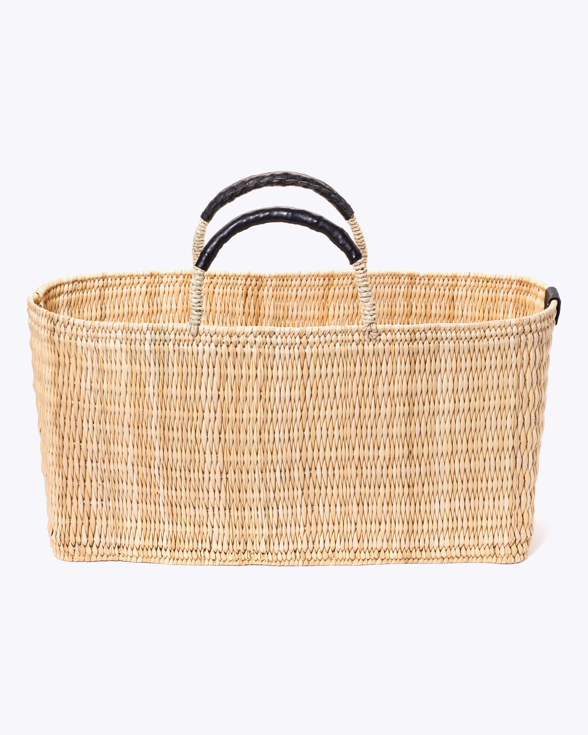 extra large straw basket wrapped with black leather handle on a white background 