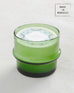large green glass Moroccan Mint candle sitting on a white background made in morocco 