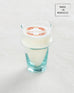 tall clear glass orangerie candle sitting on a white background made in morocco 