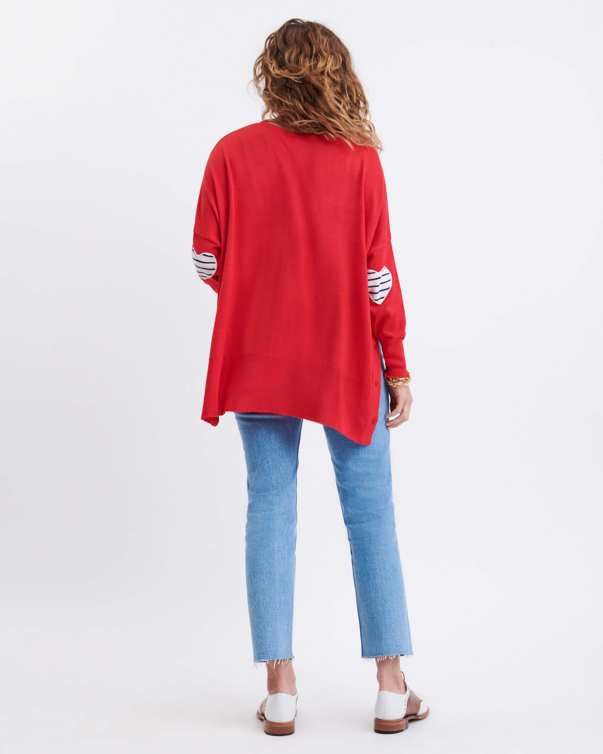 rearview of woman wearing Amour Sweater in Red and white heart elbow patch