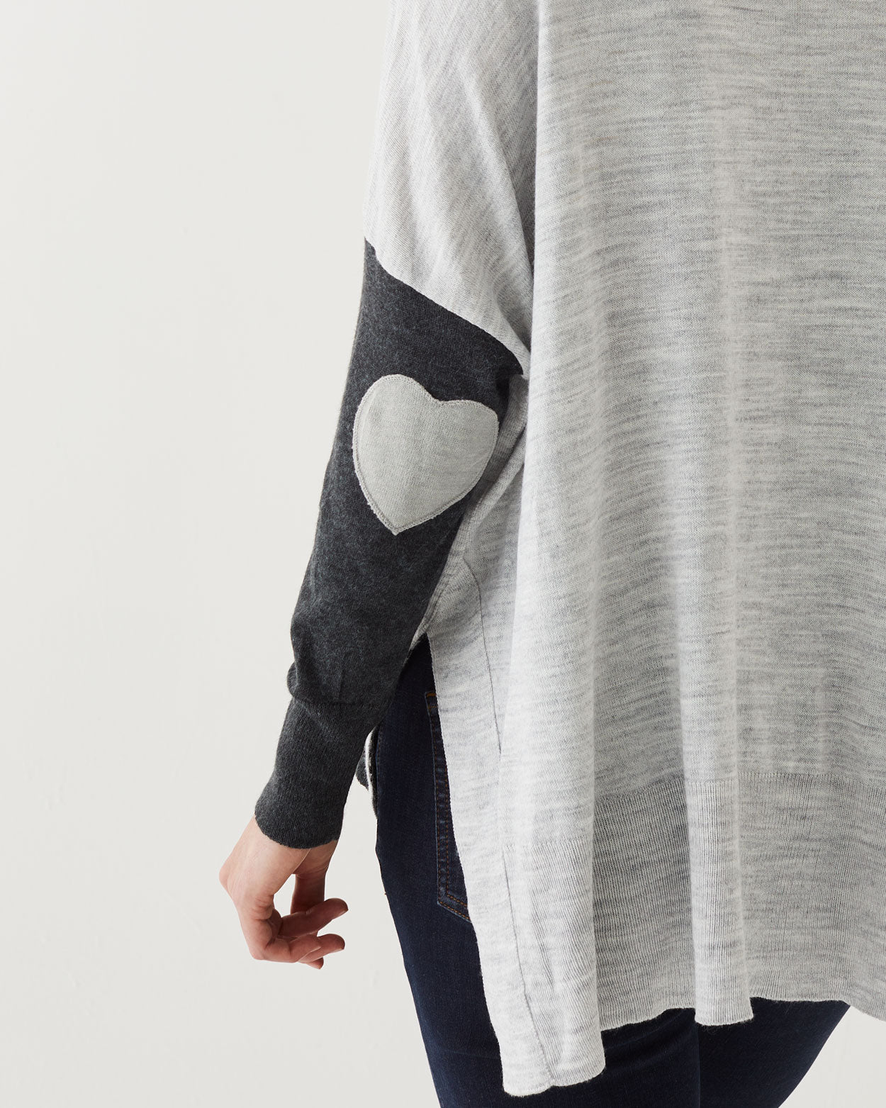 closeup of elbow on Amour Sweater in grey stripes with grey heart elbow patch