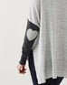 closeup of elbow on Amour Sweater in grey stripes with grey heart elbow patch