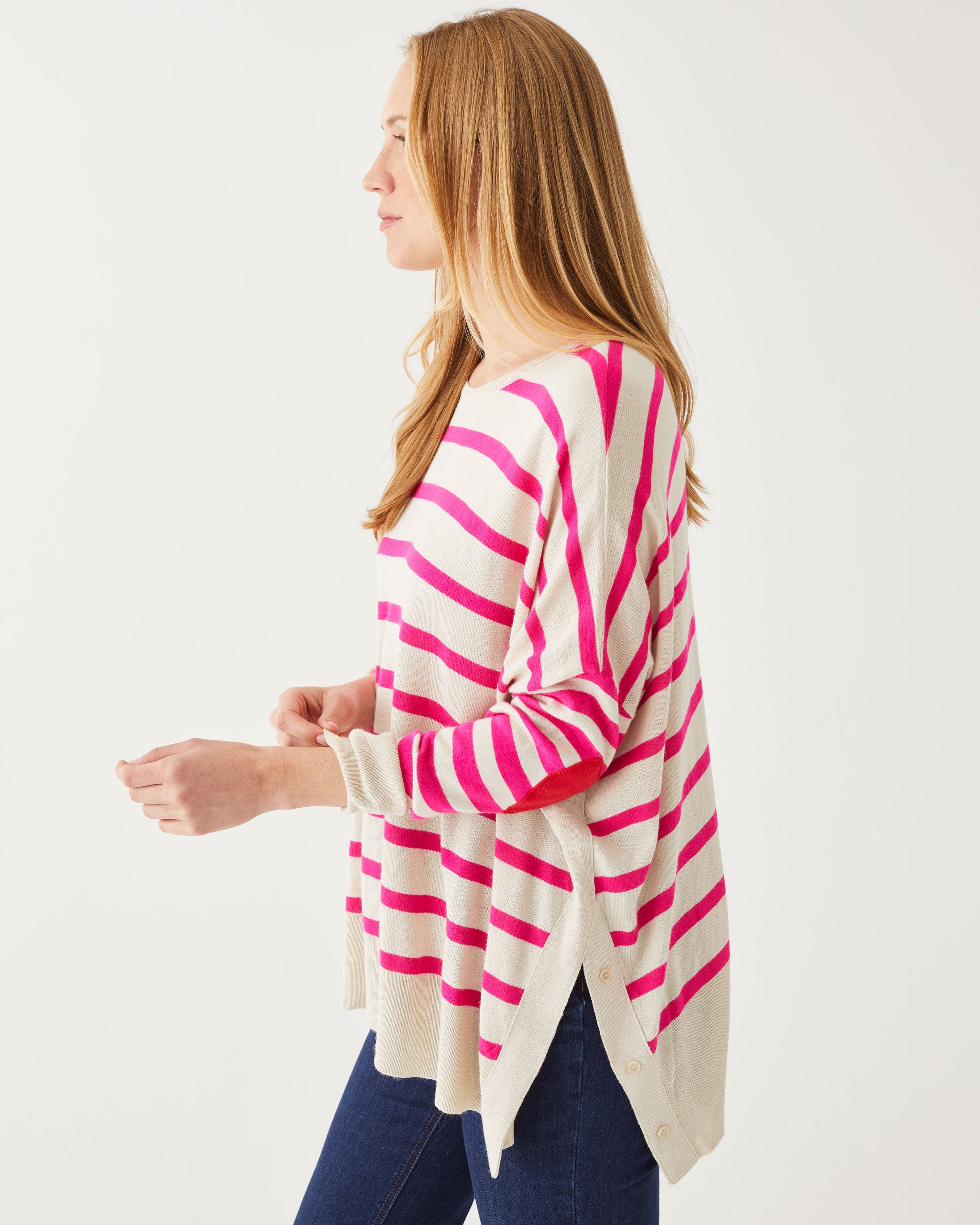 side view of woman wearing Amour Sweater in Pink Stripes and red heart elbow patch
