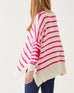 rearview of woman wearing Amour Sweater in Pink Stripes and red heart elbow patch