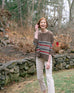 woman wearing Brown amour Sweater in multicolor stripes with red heart elbow patch