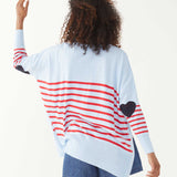 female wearing blue and red striped sweater backward with a heart elbow patch on a white background