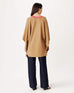Anywear v new poncho in caramel brown with red and white collar details