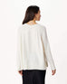 rear view woman wearing mersea banff cashmere sweater in winter white