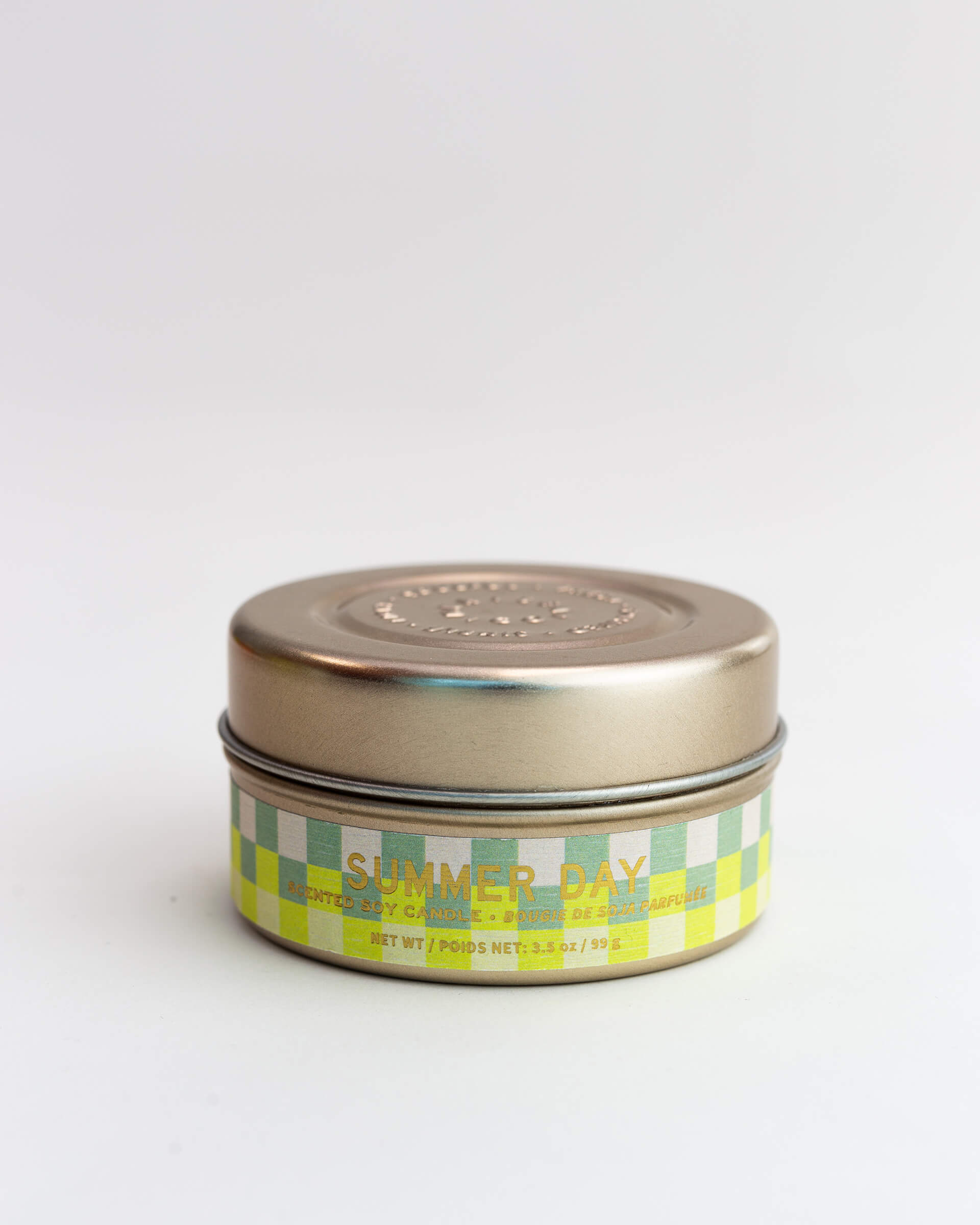 yellow and grey checkered 3 oz tin summer day candle on a white background