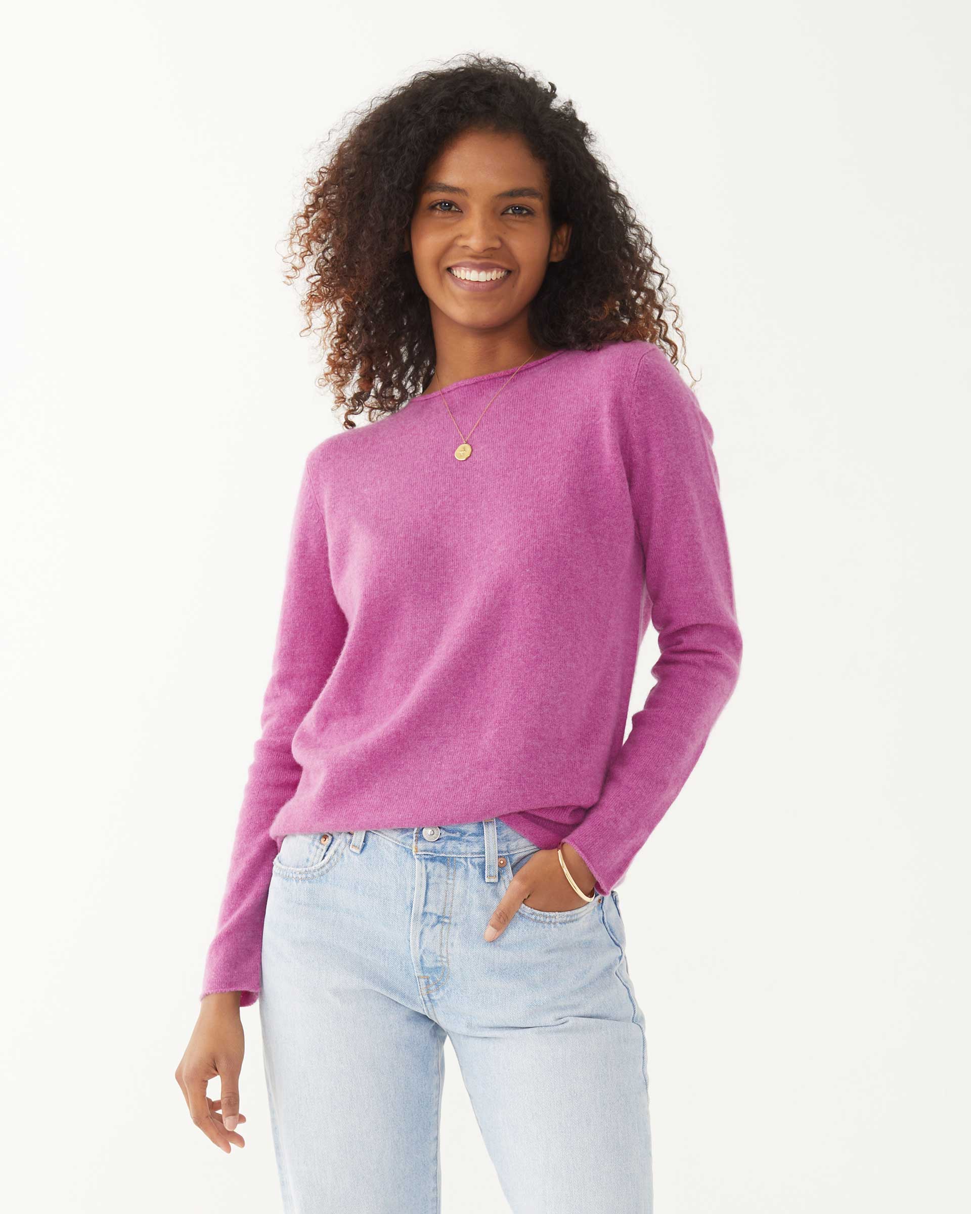 female wearing purple fitted cashmere sweater with a crewneck on a white background