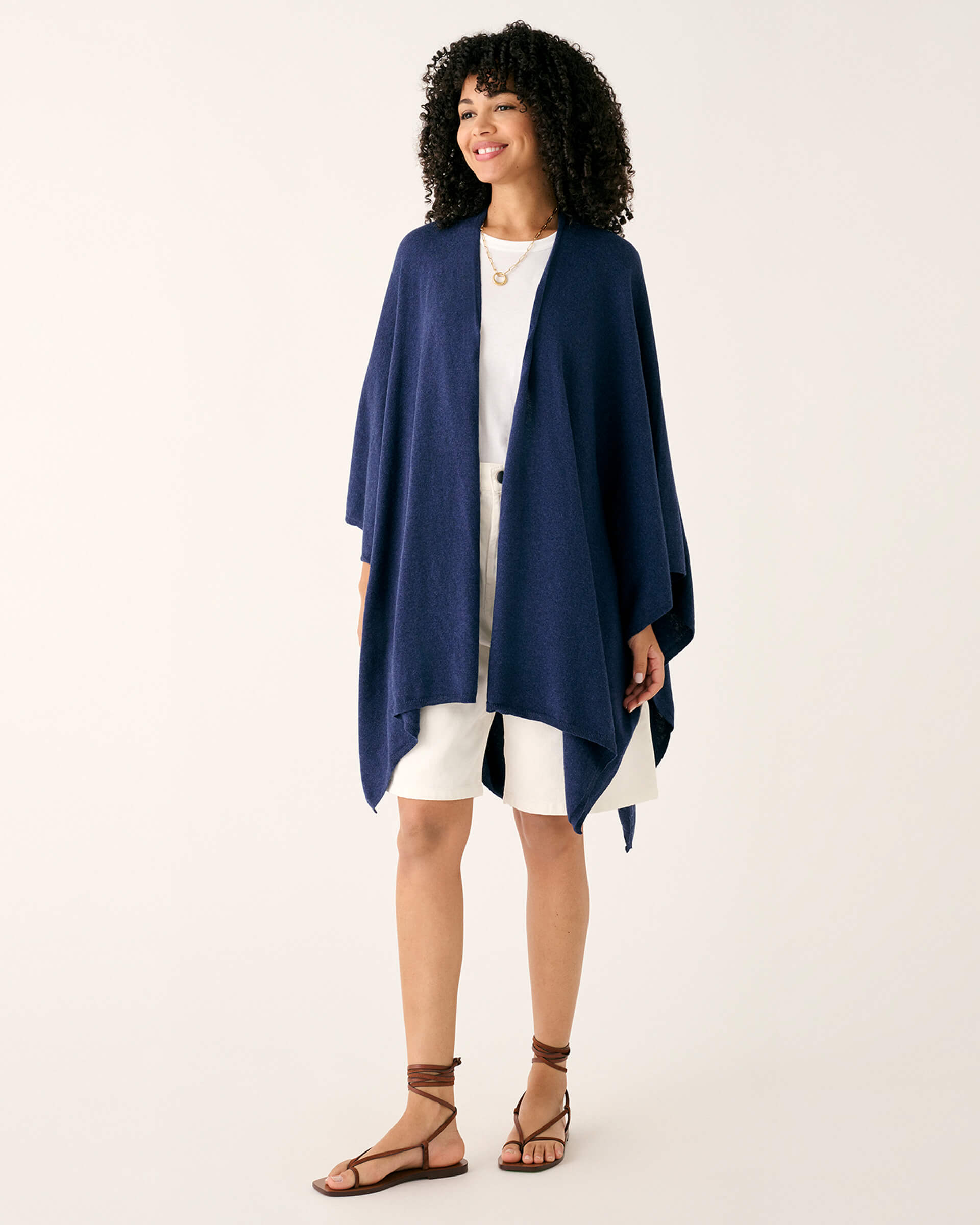 woman wearing mersea blue chambray charleston cotton cashmere wrap standing on a white background