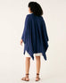 rearview of woman wearing mersea blue chambray charleston cotton cashmere wrap standing on a white background