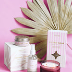 Coconut sugar product collection of candles, diffuser and room spray in front of pink background